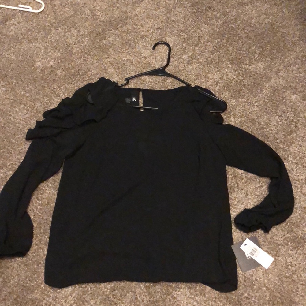 Black off the shoulder/ruffle shirt. IZ Byer